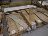 many boxes of wood on a pallet in a warehouse