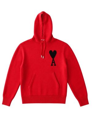 a red hoodie with a black heart on it