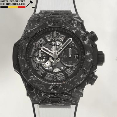 the watch is black and white with a rubber band