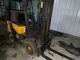a forklift that is parked in a garage