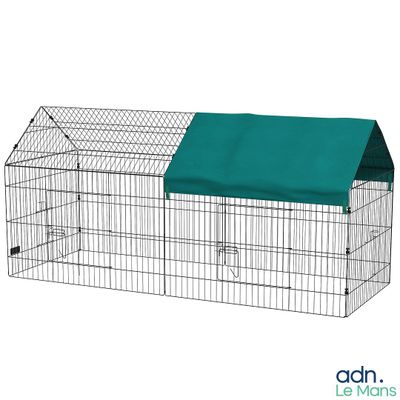 a small cage with a green cover on top of it