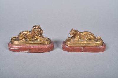 pair of antique bronze lions on red marble bases
