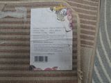a label on the back of a bed that is not in use