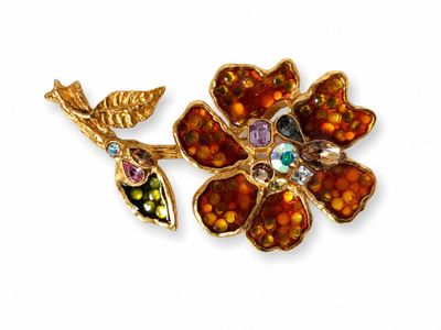 gold tone flower brooch with multi colored stones and leaves