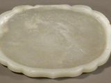 a white bowl sitting on top of a table