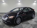 the black honda civic is parked on a checkered tile floor
