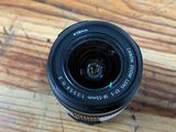 a close up of a camera lens on a wooden table
