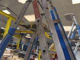 a ladder that is sitting in the middle of a room