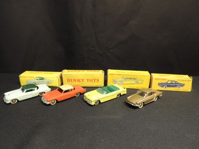 a group of five toy cars sitting next to each other