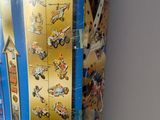a box of legos on a table with a clock on it