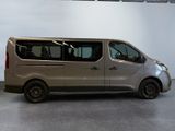 a silver van that is parked in a room