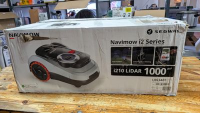 packaging of a vacuum cleaner on a wooden table in a store
