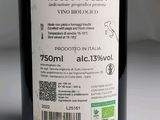 a bottle of wine sitting on a table with a label on it
