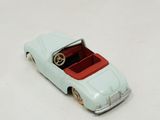 a toy car that is sitting on a white surface