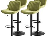 three green velvet bar stools with black metal legs