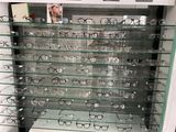 many glasses that are on display in a glass case