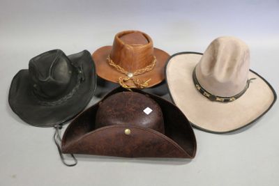 several hats are lined up on a white surface