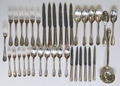 a lot of spoons and forks on the table