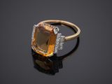 an orange sapphire and diamond ring