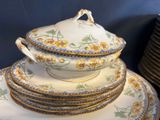 a stack of plates and a bowl on a table