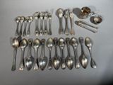 a lot of spoons and spoons that are on the table