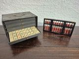 a small wooden box with a abacuse and a small box with an abacuse inside
