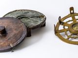 three different types of metal items on a white surface