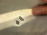 a close up of a person ' s hand holding a piece of paper