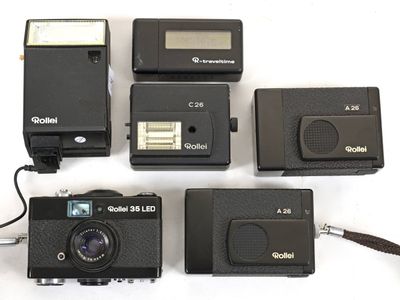 four cameras that are sitting next to each other on a table