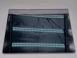a close up of a tablet with a lot of lights on it