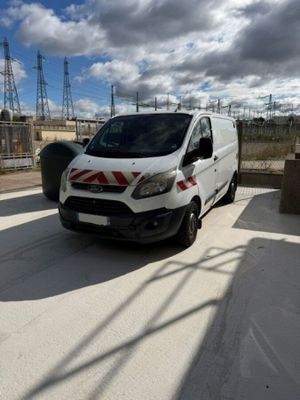 a white van that is parked on the side of the road