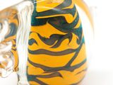 a glass vase with a yellow and black design on it