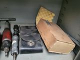 many tools that are sitting on a shelf in a cabinet