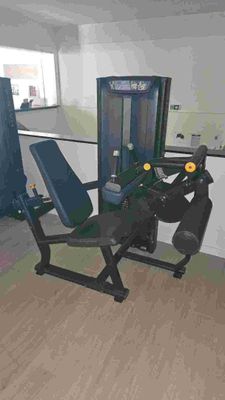 an image of a gym room with a bench and exercise equipment
