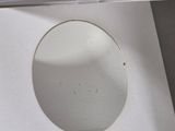 a white box with a hole in it on a table