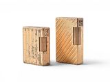 two wooden lighters sitting next to each other on a white surface