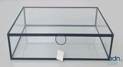 a close up of a glass box with a tag on it