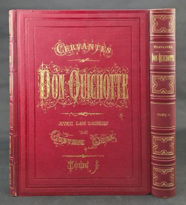 a red book with gold lettering sitting on top of a table