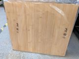a large wooden box that is sitting on the ground