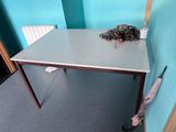 a table with an umbrella on it in a room