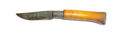 a knife with a wooden handle on a white surface