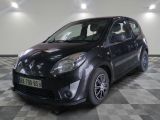 a picture of a small black car parked in a garage