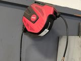 a hose attached to a wall in a garage