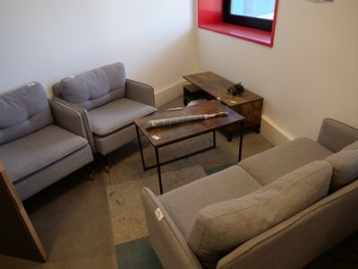 a living room with two couches and a coffee table