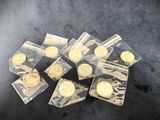 a lot of gold coins in a clear plastic bag