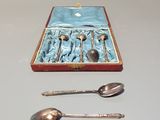 a box with spoons and spoons in it on a table