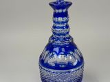 an image of a blue glass vase on a white background