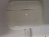 a white airpods with a red dot on it