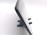 a close up of a cell phone on a stand
