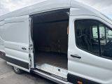 a white van with its doors open in a parking lot